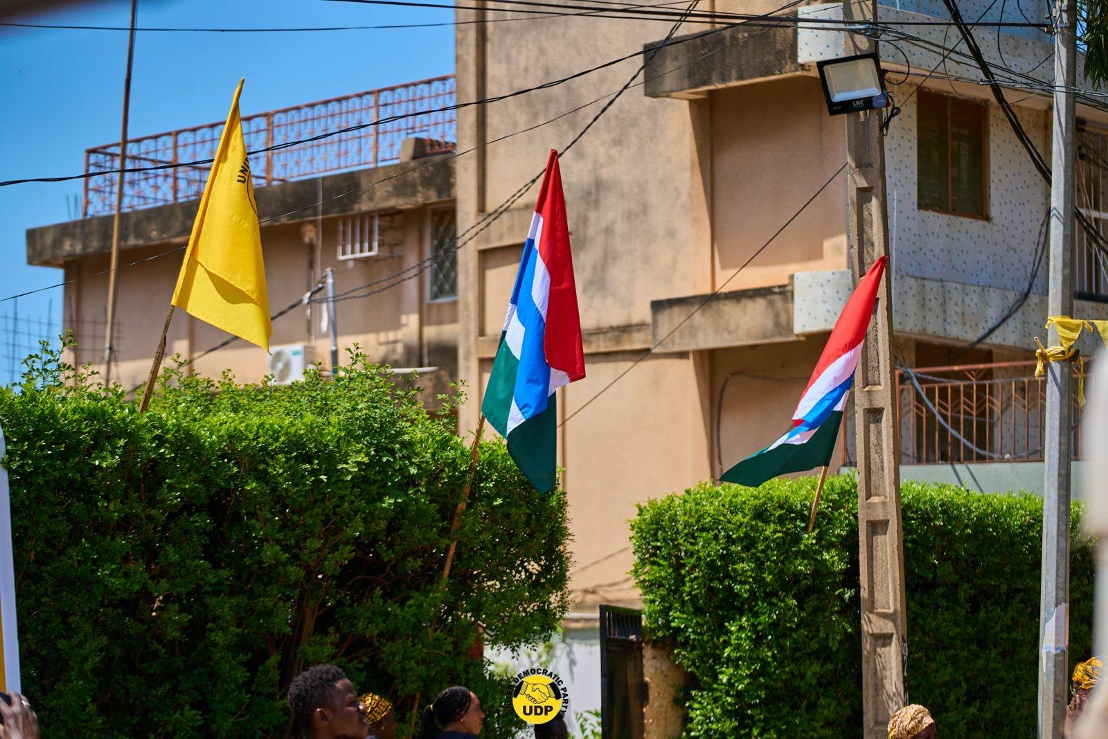 Gambian and UDP flags flying